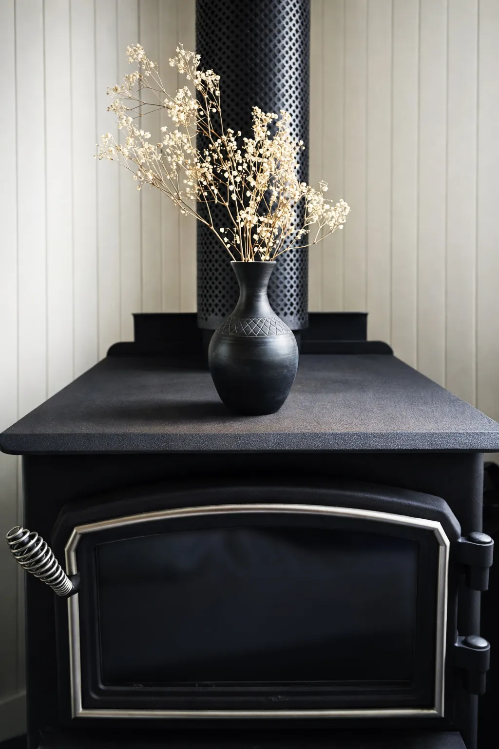 Burnished black ceramic vase with crosshatch band, smoke-fired and hand-waxed